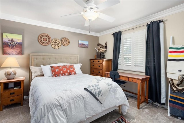 bedroom featuring ceiling fan, ornamental molding, and carpet flooring