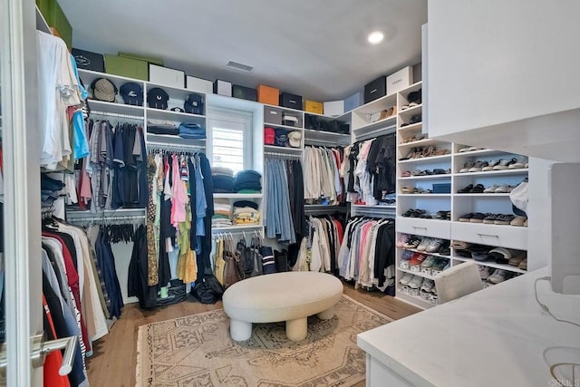 walk in closet featuring light hardwood / wood-style floors