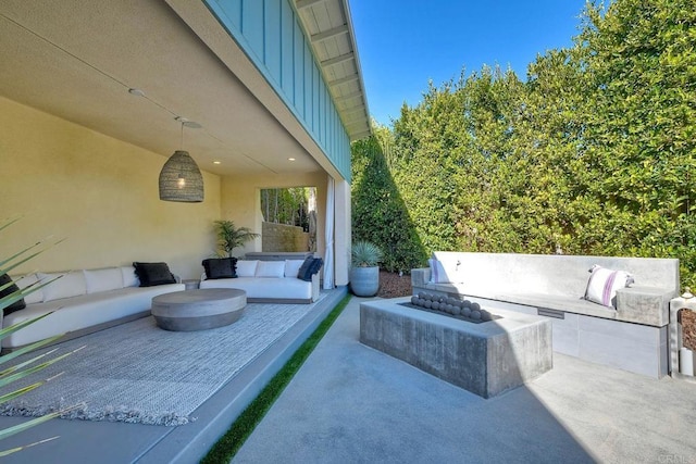 view of patio / terrace featuring an outdoor living space with a fire pit