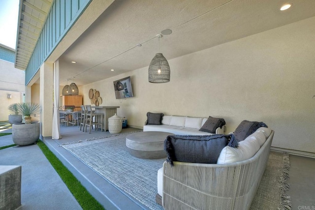 view of patio featuring an outdoor bar