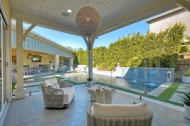 view of patio featuring exterior bar and an outdoor living space