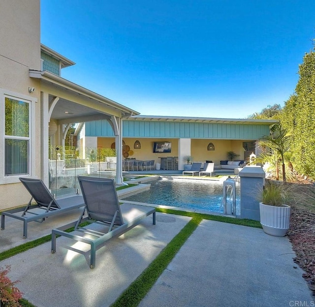 view of pool featuring a patio