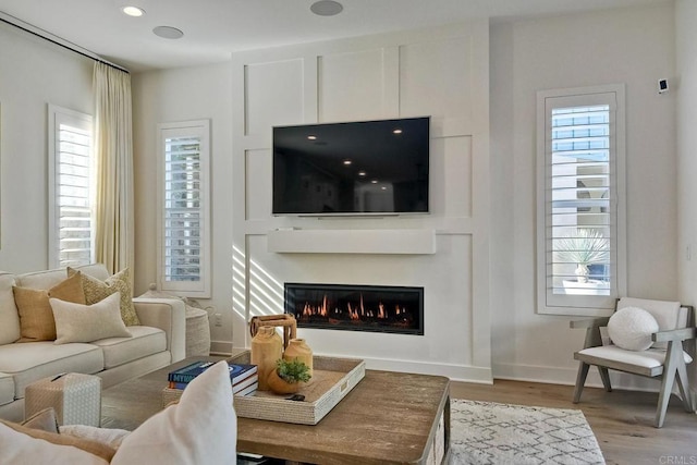 living room featuring light hardwood / wood-style floors and plenty of natural light