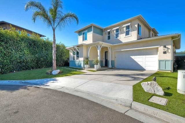 view of front of house featuring a porch, concrete driveway, a front yard, stucco siding, and an attached garage