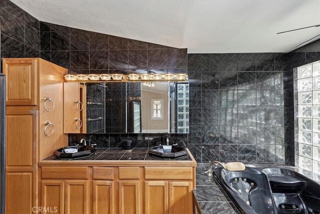 kitchen with tile walls and vaulted ceiling