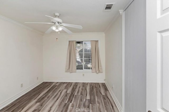 unfurnished room featuring crown molding, ceiling fan, and hardwood / wood-style flooring