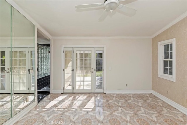 empty room with french doors, ceiling fan, and ornamental molding