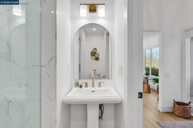 bathroom featuring a shower and wood-type flooring