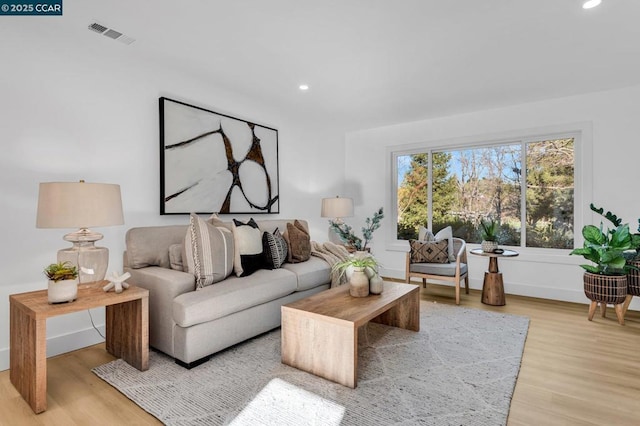 living room with light hardwood / wood-style flooring