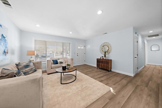 living room with light hardwood / wood-style floors