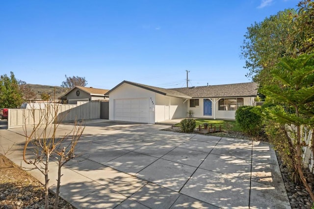 ranch-style house featuring a garage