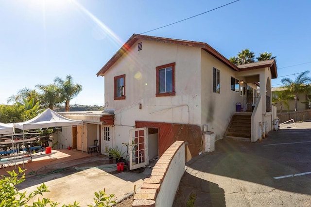 rear view of property featuring a patio