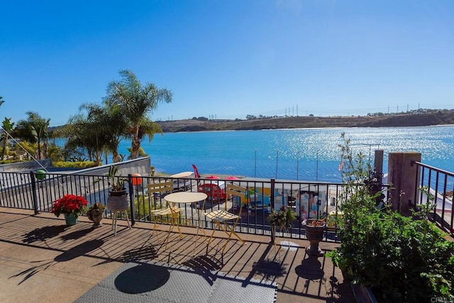 wooden deck featuring a water view