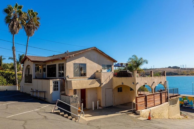 view of front of home with a water view