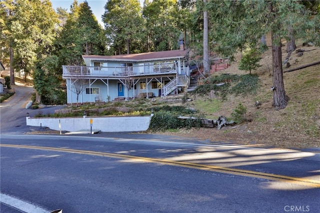 view of front of property with a wooden deck