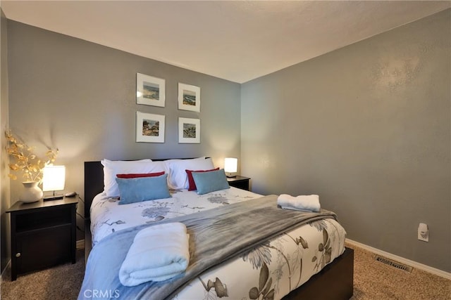 bedroom featuring dark colored carpet