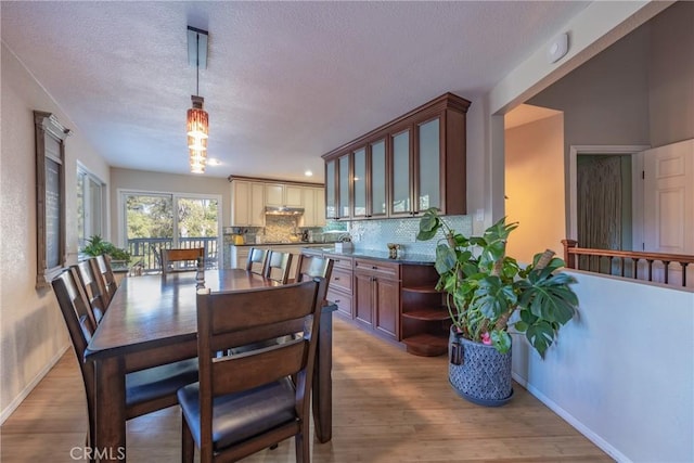 dining area with light hardwood / wood-style flooring