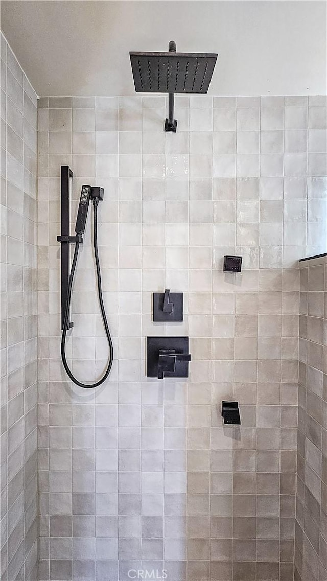 bathroom with a tile shower