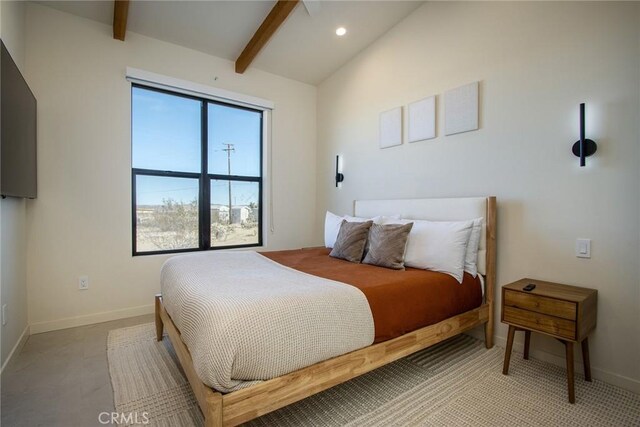 bedroom with lofted ceiling with beams