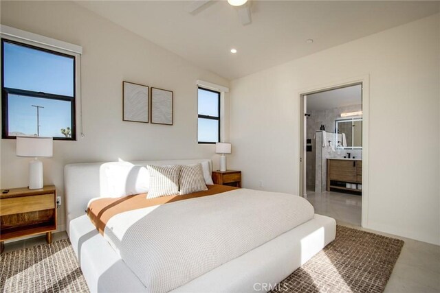 bedroom featuring ceiling fan and connected bathroom