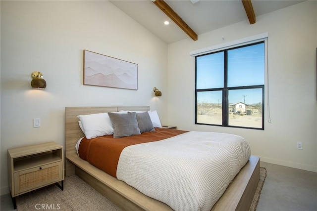 bedroom featuring vaulted ceiling with beams