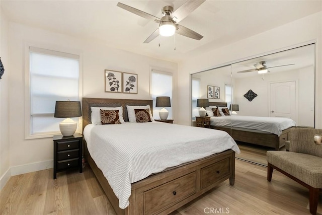 bedroom featuring a closet, ceiling fan, and light wood-type flooring