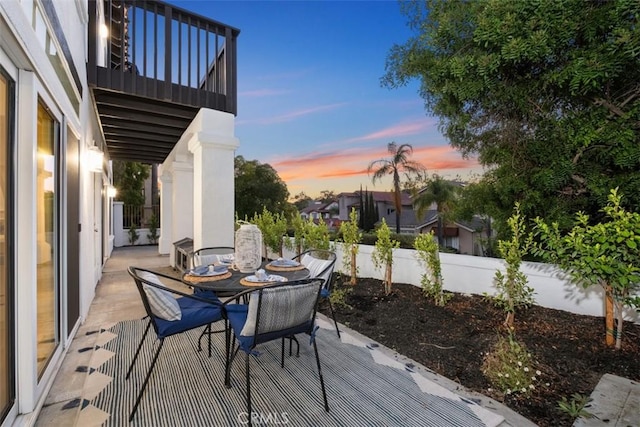 deck at dusk with a patio