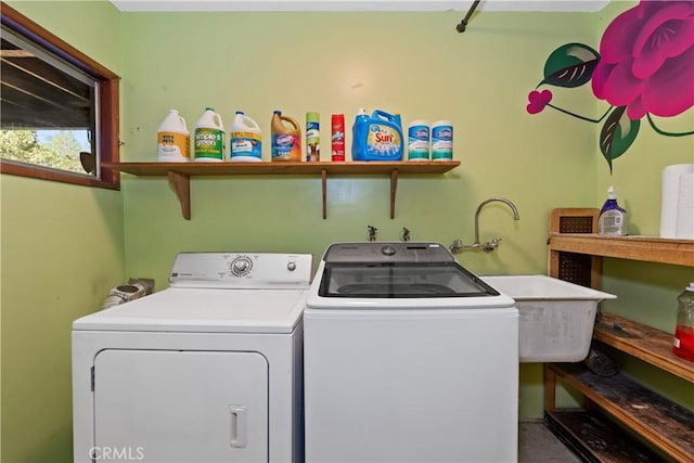 laundry area with washing machine and clothes dryer