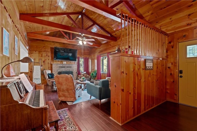 living room featuring wooden ceiling, a fireplace, dark hardwood / wood-style flooring, and wood walls