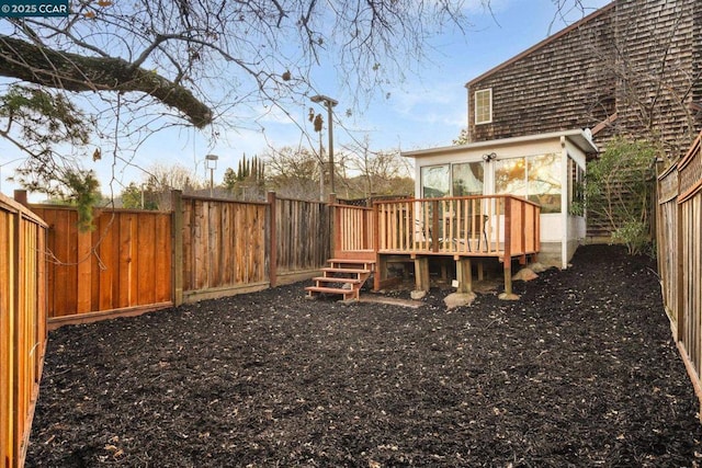 view of yard with a wooden deck