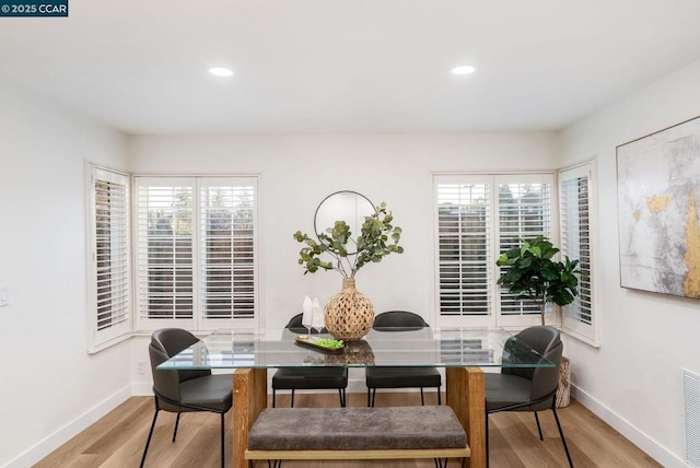 dining area with light hardwood / wood-style floors