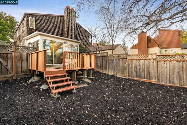 view of yard featuring a wooden deck