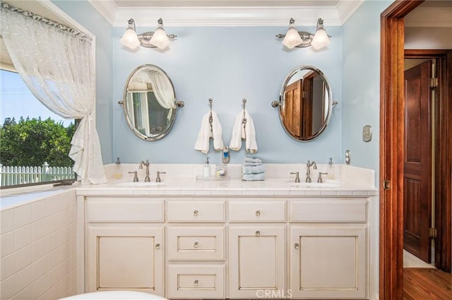 bathroom with vanity and ornamental molding