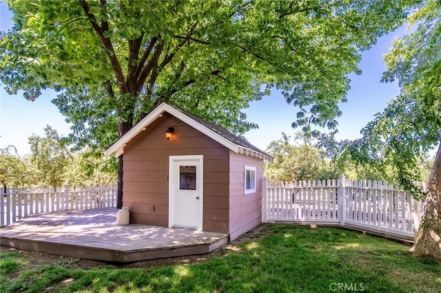 view of outbuilding featuring a yard