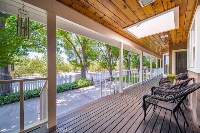 wooden terrace with a porch