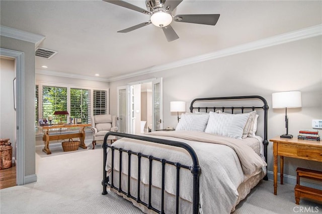 carpeted bedroom featuring ceiling fan and crown molding