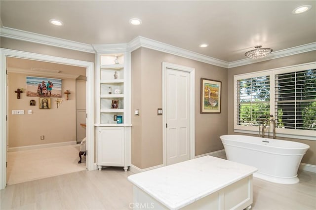 bathroom featuring a bathtub and ornamental molding