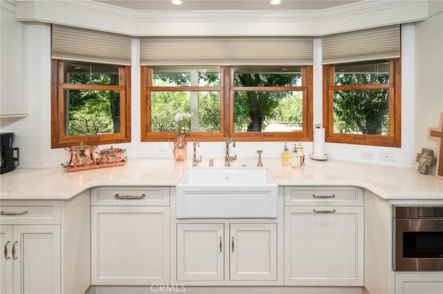 interior space featuring decorative backsplash and sink