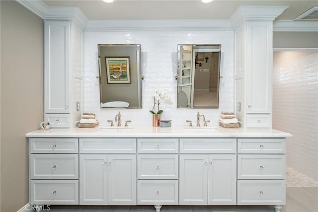 bathroom with vanity and ornamental molding