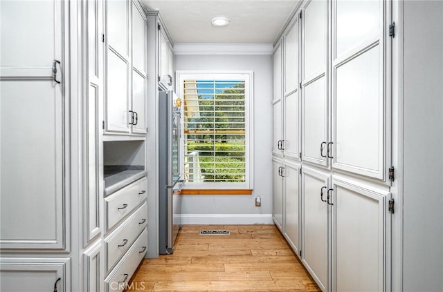 spacious closet with light hardwood / wood-style floors