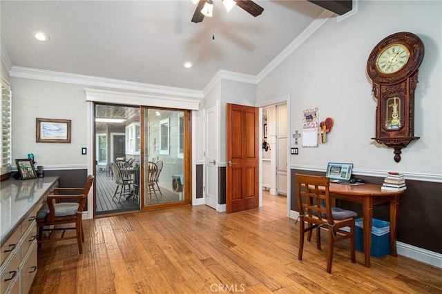 office area with ceiling fan, light wood-type flooring, vaulted ceiling, and ornamental molding