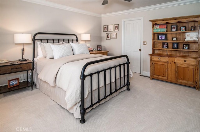 bedroom featuring ceiling fan, crown molding, and light carpet