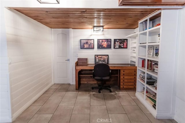 office space featuring light tile patterned flooring and wood ceiling