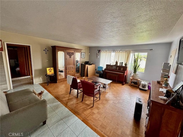 living room with a textured ceiling and light parquet flooring