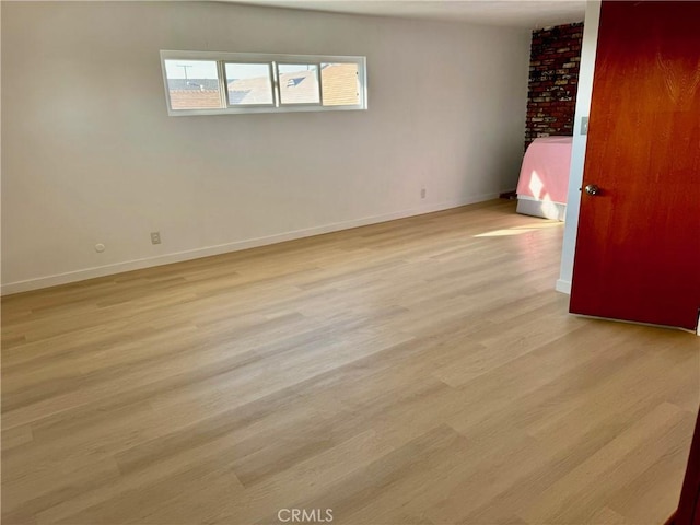 empty room with light wood-type flooring