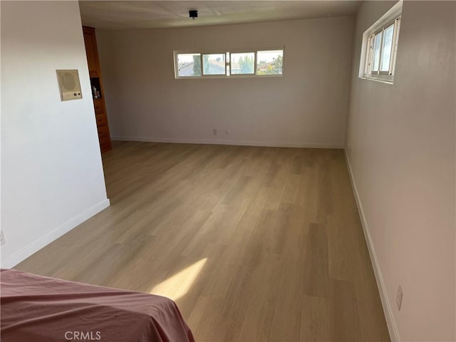 spare room featuring light hardwood / wood-style floors