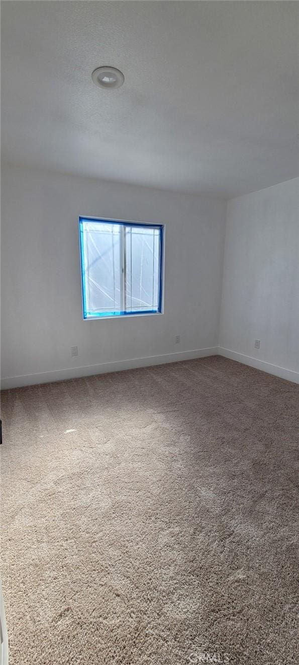 empty room featuring carpet