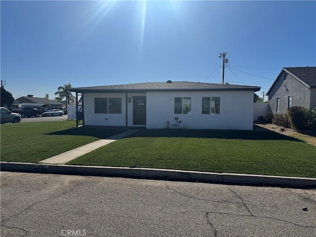 ranch-style house with a front lawn