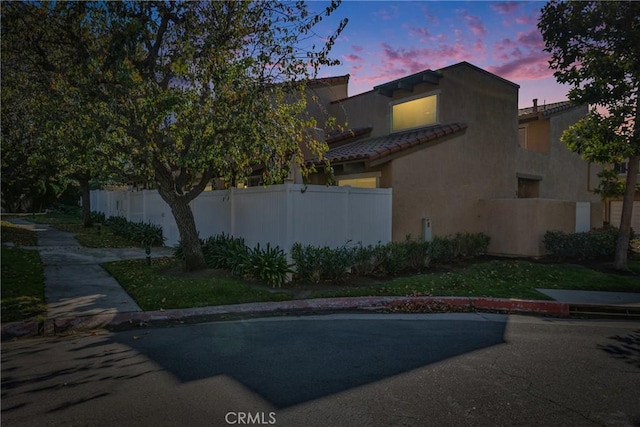 view of property exterior at dusk