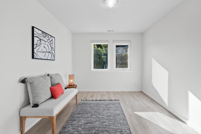 living area with light hardwood / wood-style floors